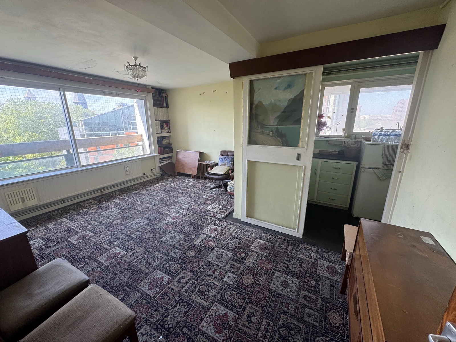 Battersea living area in its original run-down condition