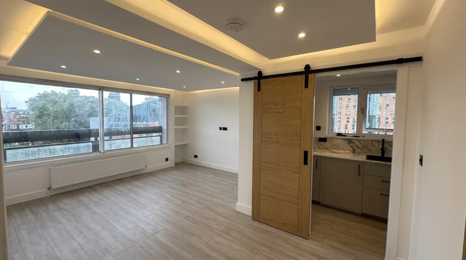 Completed open living area with new flooring and joinery