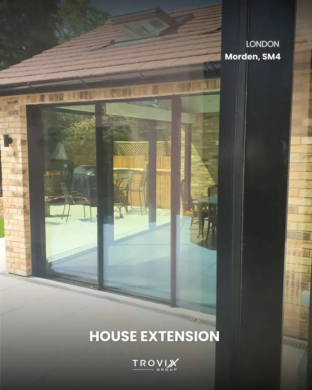 Completed rear house extension with sliding doors onto the garden in Morden, South London, by Trovix