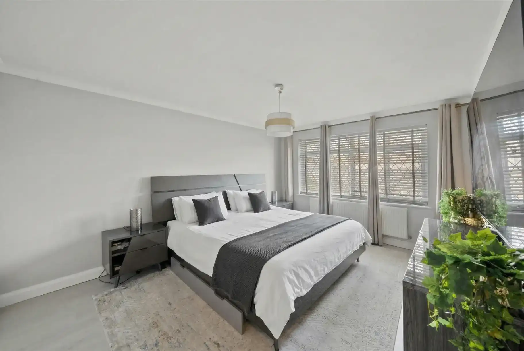 Renovated bedroom with new flooring and lighting in Uxbridge, West London